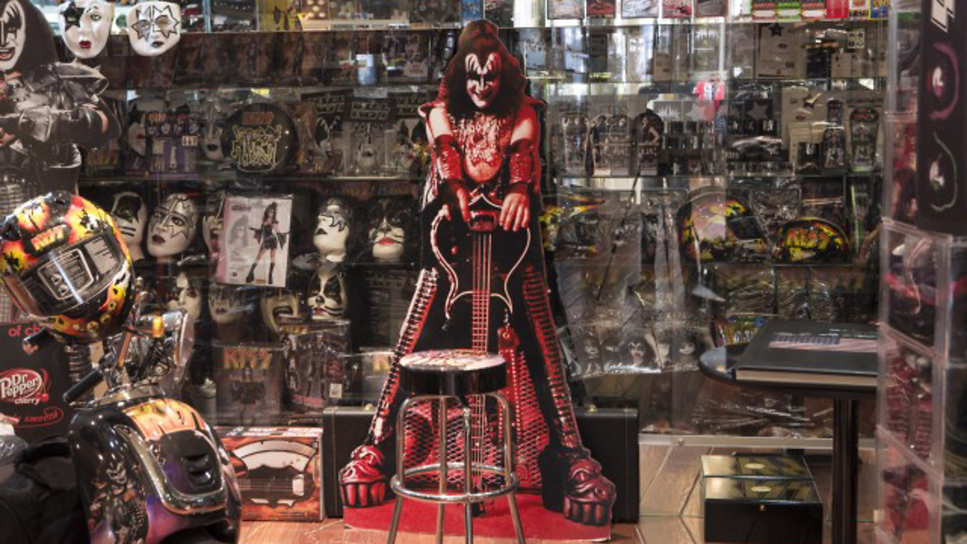 The rock band Kiss' wide reaching merchandising is on display in Gene Simmons' office in his Beverly Hills home, which he shares with his wife Shannon Tweed, as seen on HGTV Celebrities at Home. Simmons, a producer, entrepreneur and actor is the bassist and singer-songwriter of the rock band Kiss, which has sold over 100 millions albums.